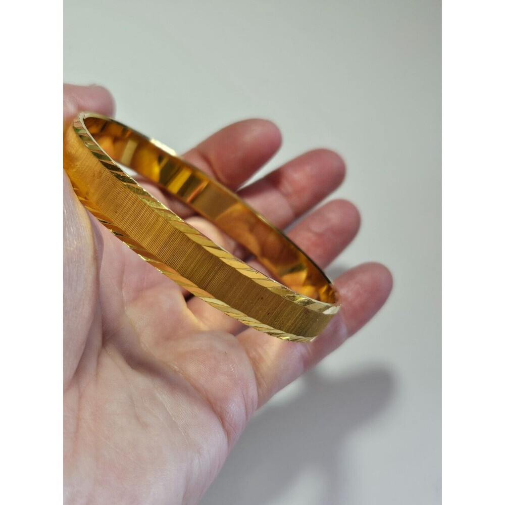 Trifari with crown gold tone bangle bracelet 7.75"